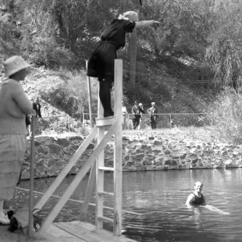 Black and White Photo of Woman Preparing to Dive