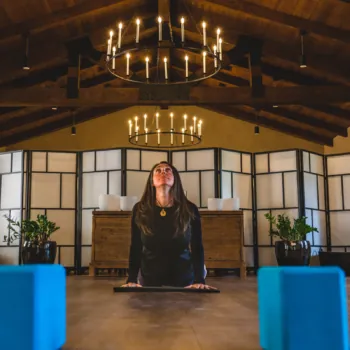 Woman Doing Yoga in a Serene Wooden Lodge