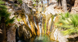 Rock walls surrounding mineral hot springs at Castle Hot Springs resort.