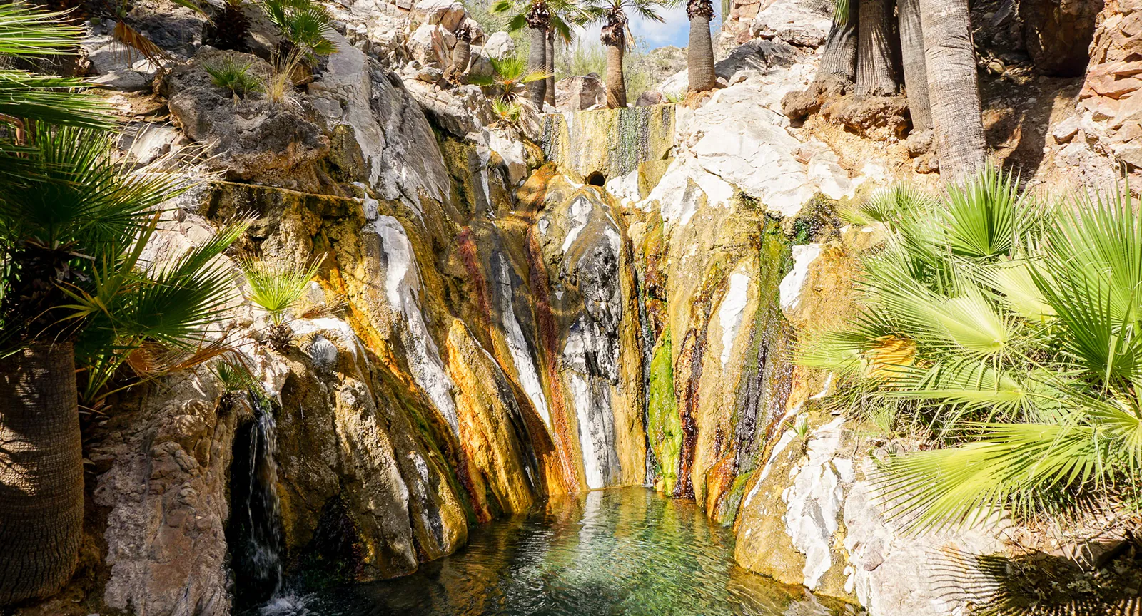 Rock walls surrounding mineral hot springs at Castle Hot Springs resort.