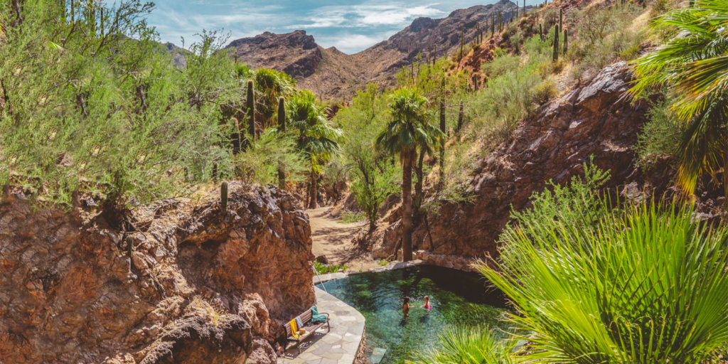 Aerial View of Two Swimmers in the Hot Springs at a luxury hot springs resort in the USA