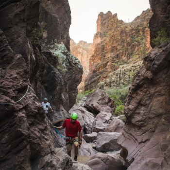 Two people hiking through a canyon at an inclusive adults only resort in Arizona