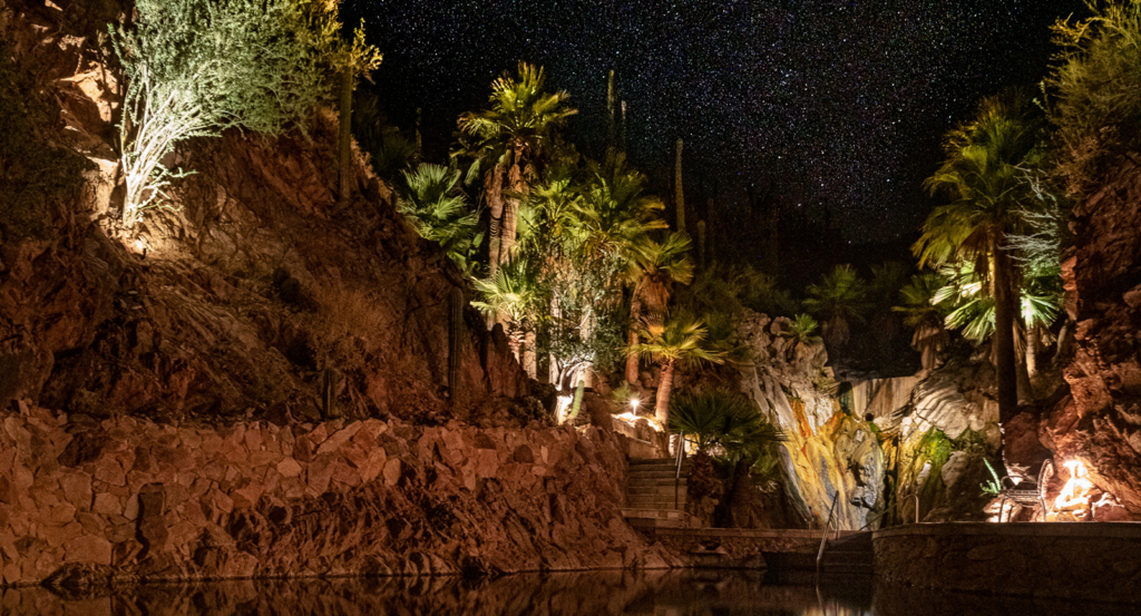 The hot springs in the dark with the Arizona night sky full of stars