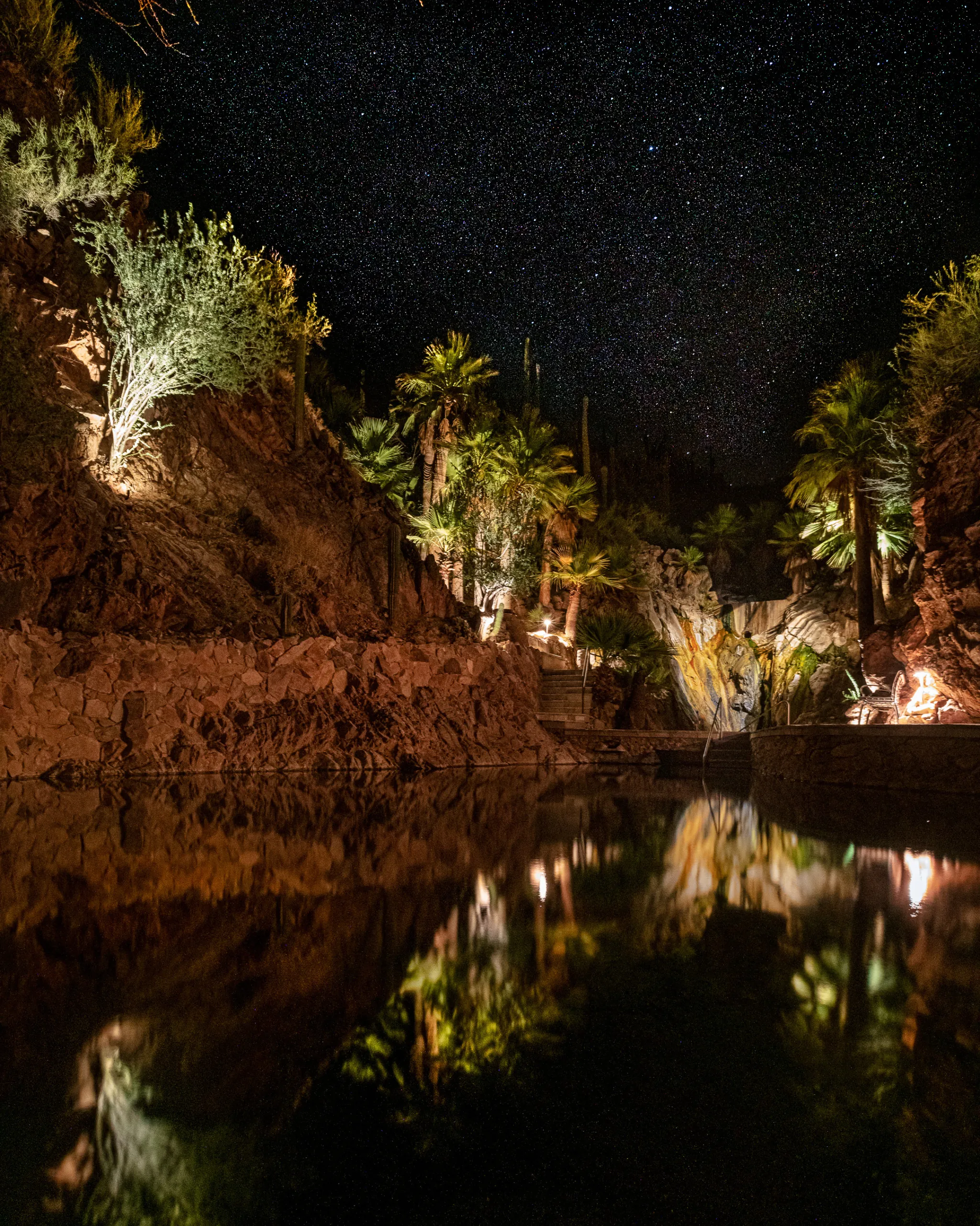 The natural hot springs at night at Castle Hot Springs, a luxury Arizona resort