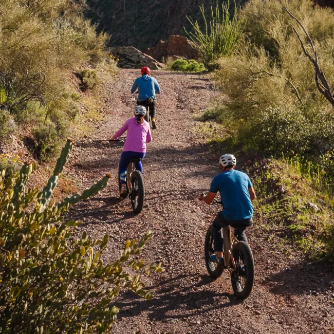 People biking yoga at Castle Hot Springs, a luxury wellness resort in Arizona