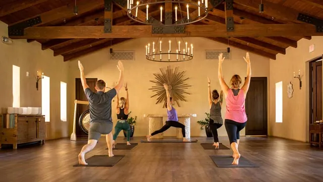 Five people doing yoga at Castle Hot Springs