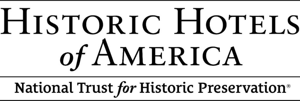 A white background with the text that reads “Historic Hotels of America” and underneath that “National Trust for Historic Preservation”.