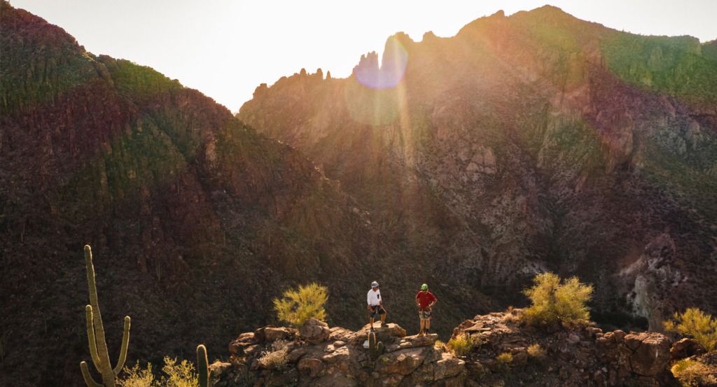 The sun over a mountain range during an adventure in Arizona.