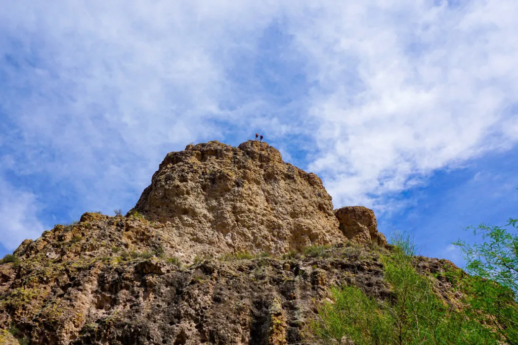 Guide who is rock rappelling over a cliff in Arizona.