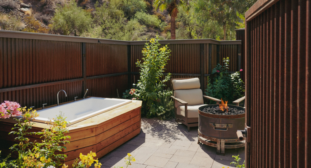 A soaking tub and firepit on a private terrace at an all-inclusive resort near Phoenix, Arizona