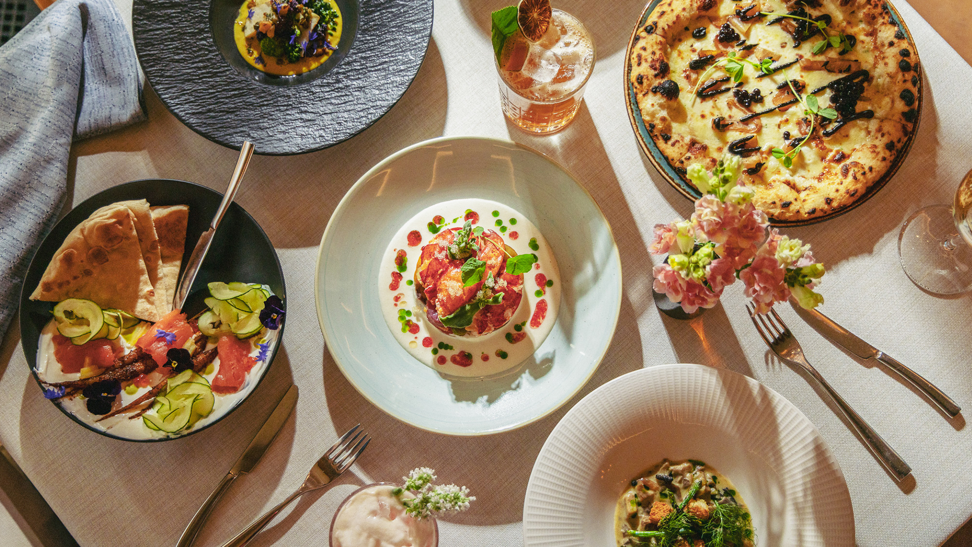 Multiple dinner plates at Harvest Restaurant at Castle Hot Springs