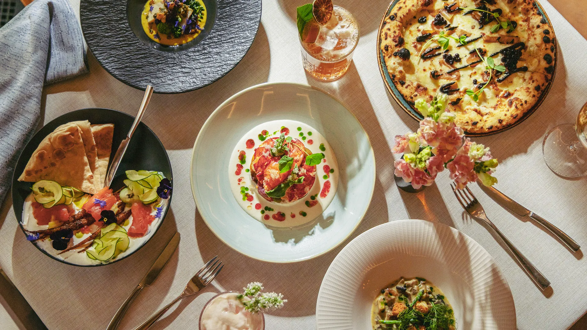 Multiple dinner plates at Harvest Restaurant at Castle Hot Springs