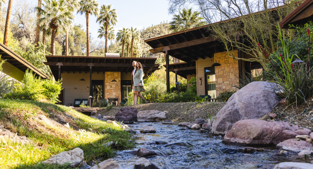 A couple walking between bungalows in Arizona