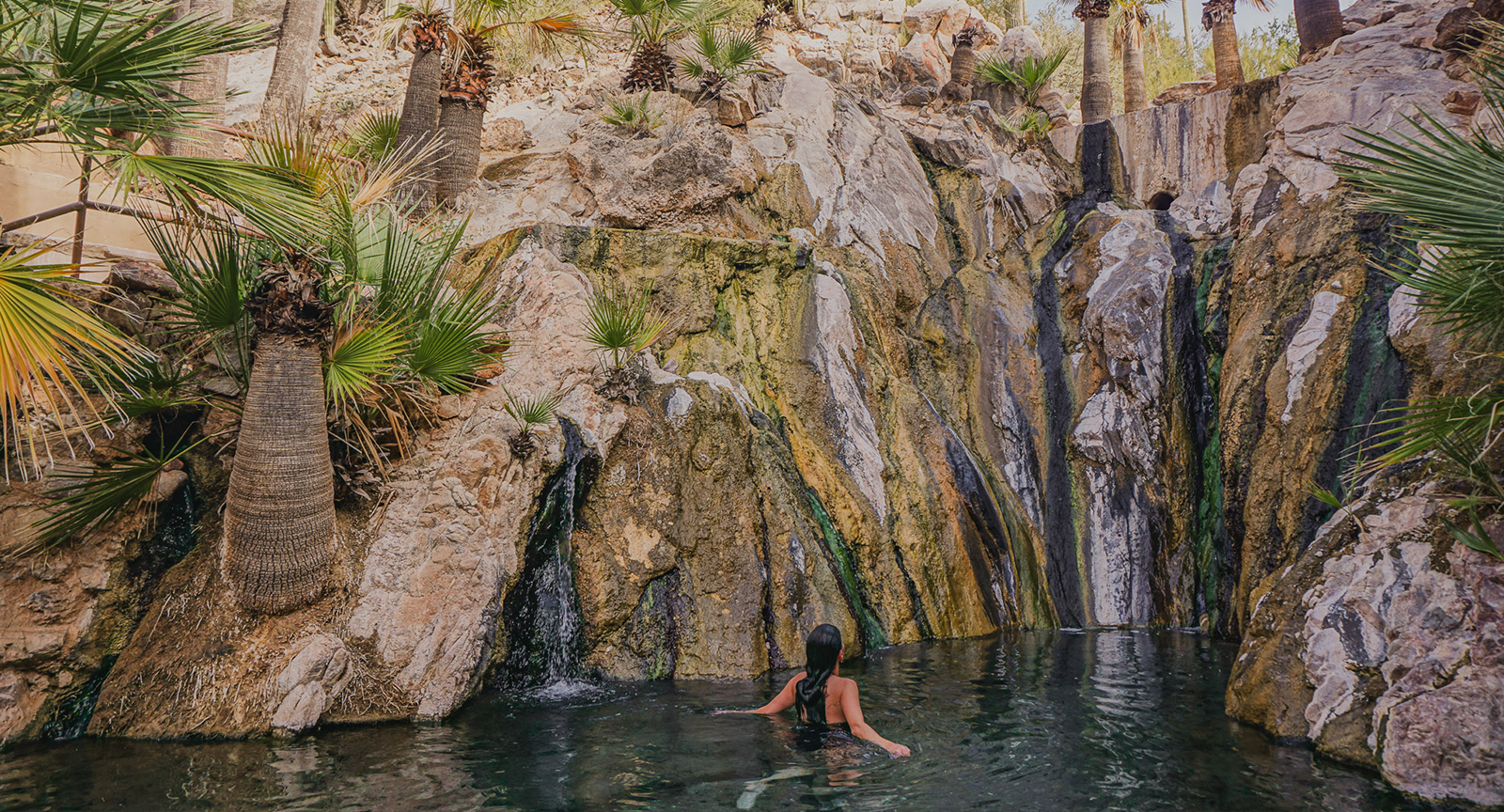 A woman soaking in natural hot springs.