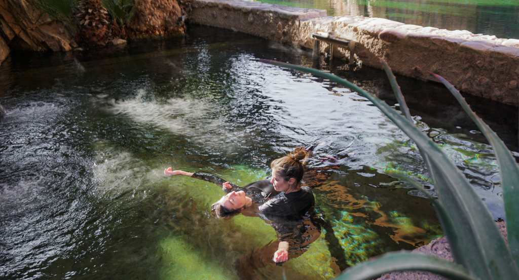 Floating in the water during a spa treatment.