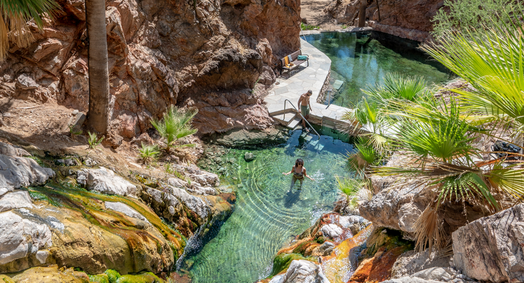 Two guests enjoying a hot spring circuit at Castle Hot Springs