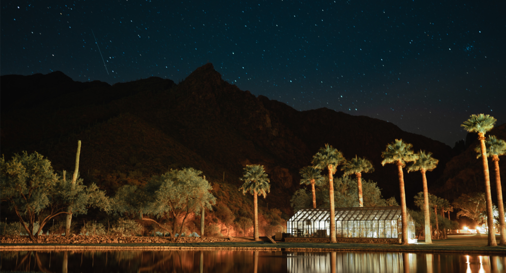 Castle Hot Springs resort at night with starry skies.