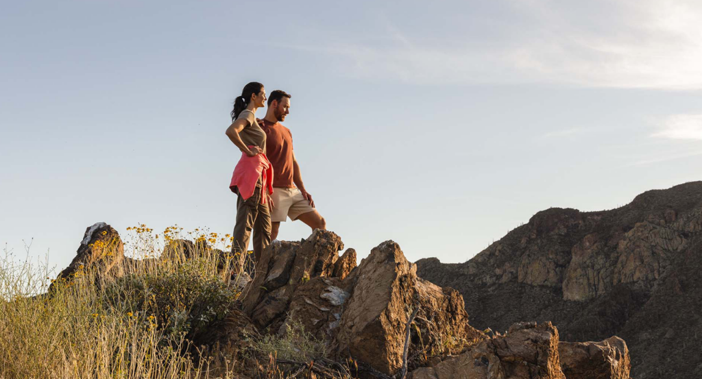 A couple hiking in the desert on an Arizona road trip