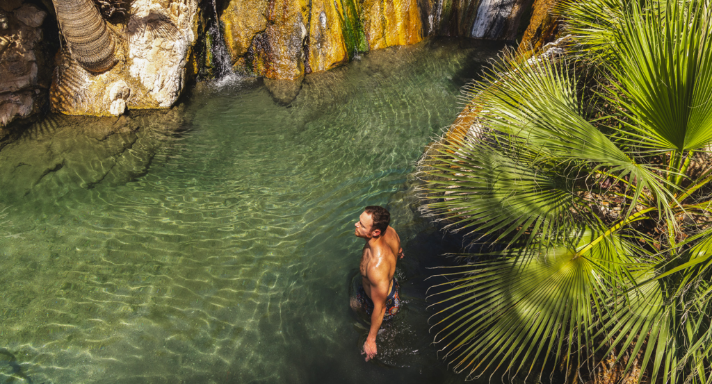 A man in the hot springs, perfect for arizona solo travel 