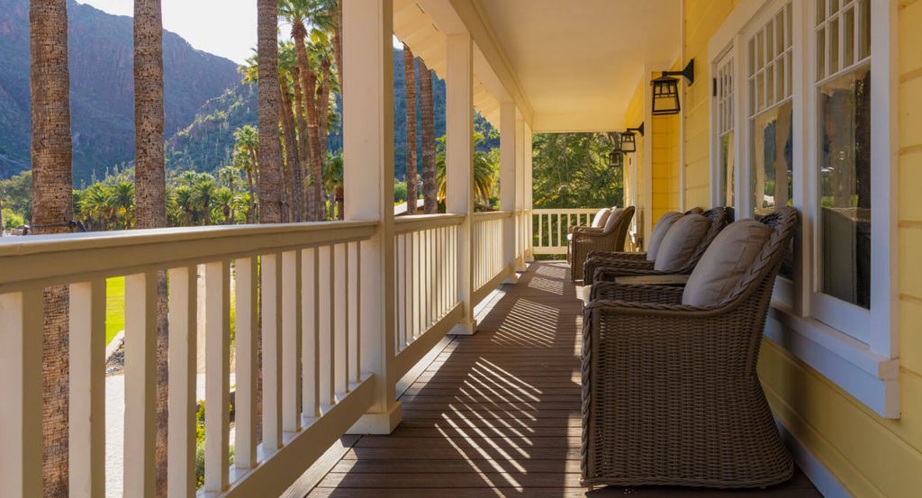 Cottages in Arizona like the Historic Cottage include wraparound decks overlooking palm trees.